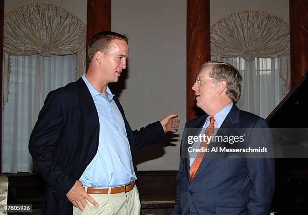 Indianapolis Colts quarterback Peyton Manning talks with U. S. Ambassador Thomas Schieffer at a reception at the United States Embassy in Tokyo Aug....