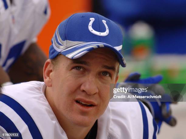 Indianapolis Colts quarterback Peyton Manning checks the scoreboard during play against the Jacksonville Jaguars December 11, 2005 in Jacksonville....