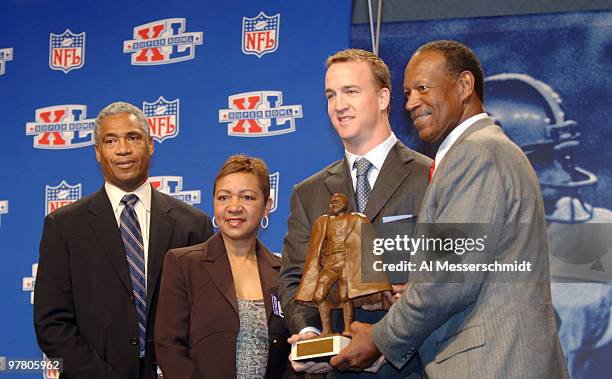 Mike Haynes of the NFL, Connie Payton, Walter Payton's wife, Peyton Manning and Gene Upshaw, President of the NFL Player's Association at the Walter...