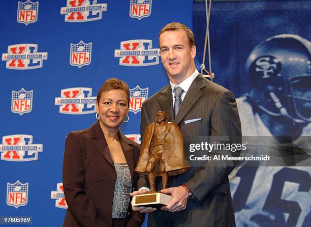 Connie Payton, Walter Payton's wife with Peyton Manning at the Walter Payton NFL Man of the Year press conference at the Super Bowl XL Media Center...