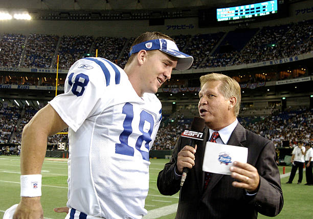 Indianapolis Colts quarterback Peyton Manning talks with ESPN sideline reporter Chris Mortensen during the 2005 American Bowl August 6 at the Tokyo...