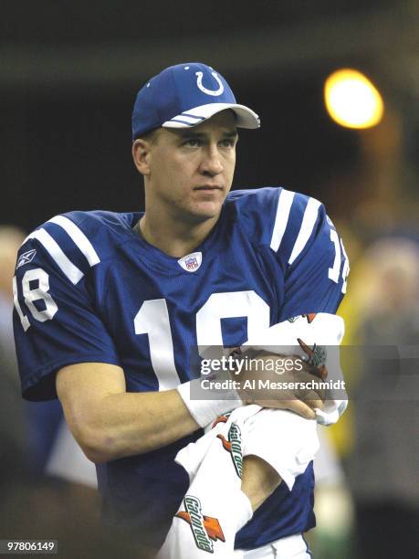 Indianapolis Colts quarterback Peyton Manning watches play against the Baltimore Ravens in a Sunday night football game, December 19, 2004 at the RCA...