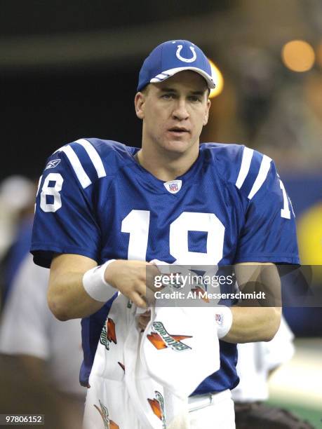 Indianapolis Colts quarterback Peyton Manning watches play against the Baltimore Ravens in a Sunday night football game, December 19, 2004 at the RCA...