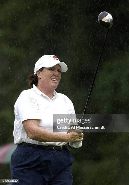 Meg Mallon follows her drive in the rain on the fourth hole Thursday, October 9, 2003 at the Samsung World Championship in Houston, Texas. Rain...