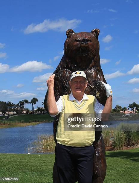 Jack Nicklaus poses with the bear on the 15th tee that signifies the final four holes known as the 'Bear Trap' on the Champion Course that he...