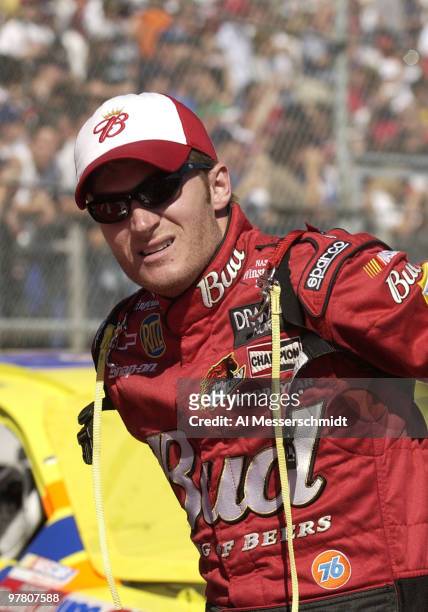 Dale Earnhardt Jr.adjusts his harness during pre-race introductions Sunday, October 19, 2003 at the NASCAR Subway 500 at Martinsville Speedway,...