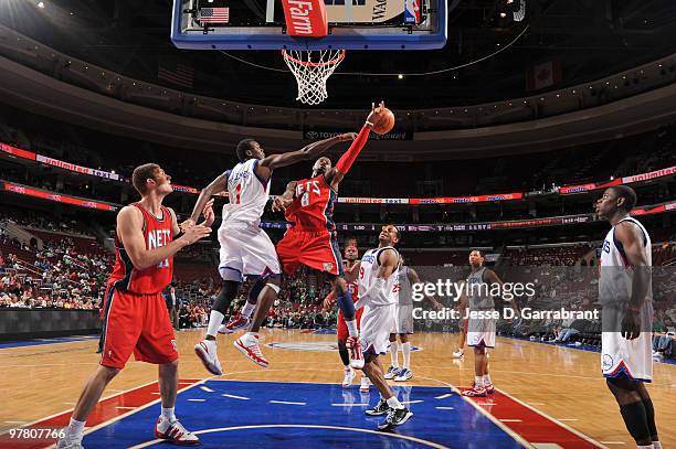 Samuel Dalembert of the Philadelphia 76ers blocks a shot by Terrence Williams of the New Jersey Nets during the game on March 17, 2010 at the...