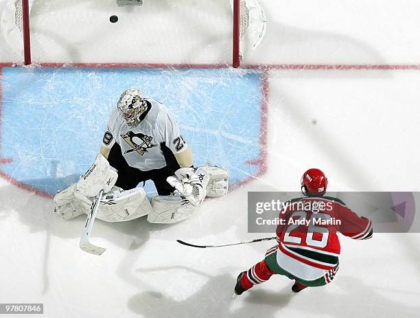 Marc-Andre Fleury of the Pittsburgh Penguins cannot stop a shorthanded breakaway goal by Patrik Elias of the New Jersey Devils during the game at the...