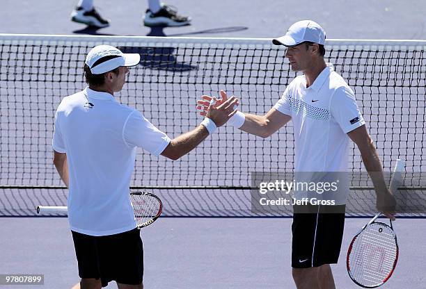 The team of Paul Hanley of Australia and Simon Aspelin of Sweden congratulate each other following their doubles victory over the team of Johan...