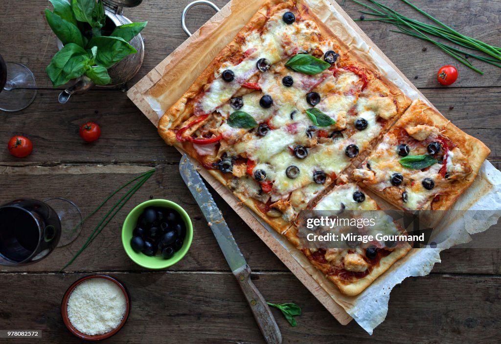 Pizza with bbq sauce, chicken and bacon