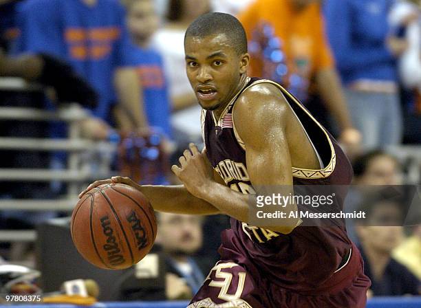 Florida State University guard Nate Johnson drives to the basket January 3, 2004 at the Stephen C. O'Connell Center, Gainesville, Florida. FSU was...