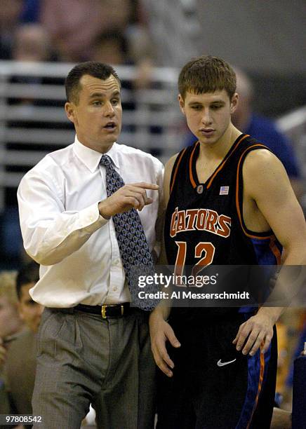 Florida men's basketball coach Billy Donovan gives a play to guard Lee Humphrey January 3, 2004 at the Stephen C. O'Connell Center, Gainesville,...