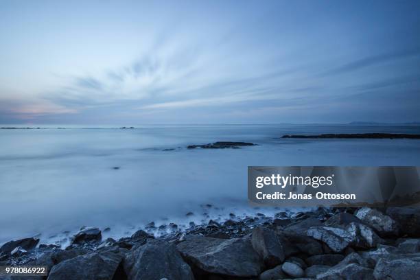 rocky seashore at evening, akranes, iceland - akranes bildbanksfoton och bilder