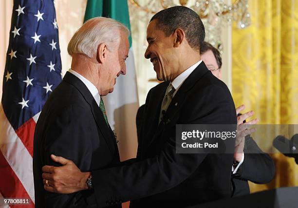 President Barack Obama greets Vice President Joe Biden during the annual St. Patrick's Day Reception in the East Room of the White House, March 17,...