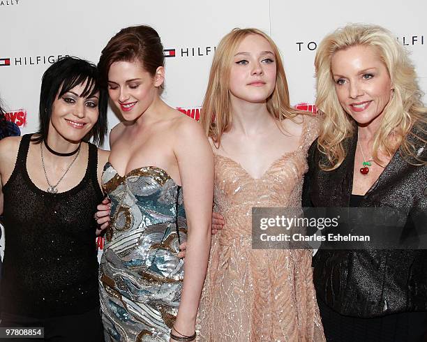 Musician Joan Jett, actress Kristen Stewart, actress Dakota Fanning and musician Cherie Currie attend "The Runaways" New York premiere at Landmark...