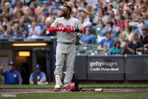 Carlos Santana of the Philadelphia Phillies reacts after striking out in the first inning against the Milwaukee Brewers at Miller Park on June 16,...