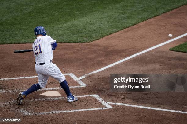 Travis Shaw of the Milwaukee Brewers strikes out in the fourth inning against the Philadelphia Phillies at Miller Park on June 16, 2018 in Milwaukee,...