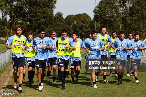 Sydney FC players warm up during a Sydney FC A-League training session at Macquarie Field on March 18, 2010 in Sydney, Australia.