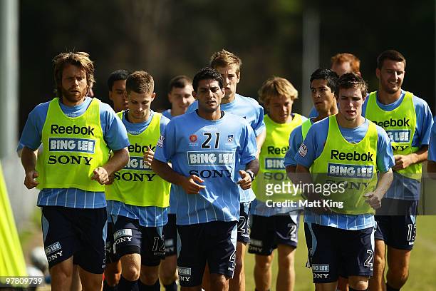 Simon Colosimo leads players on a warm up during a Sydney FC A-League training session at Macquarie Field on March 18, 2010 in Sydney, Australia.