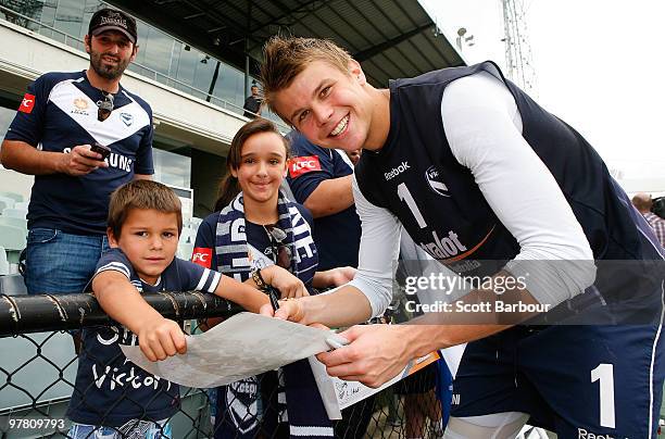 Mitchell Langerak signs autographs for fans after the Melbourne Victory A-League training session at Olympic Park on March 18, 2010 in Melbourne,...