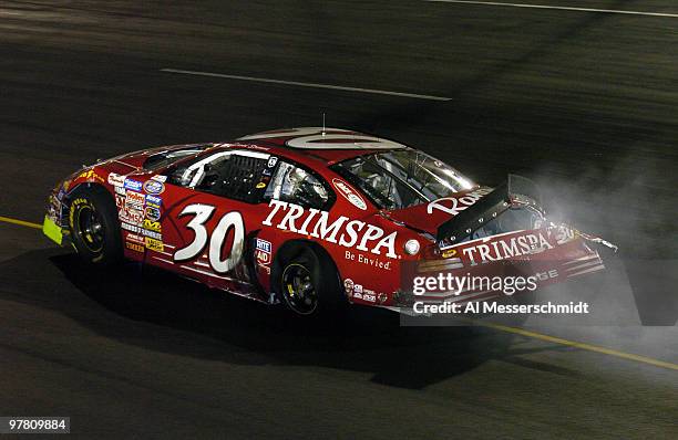 David Stremme hits the second turn wall and heads to the pits with a flat rear tire during the Funai 250 NASCAR Busch Series race at Richmond...