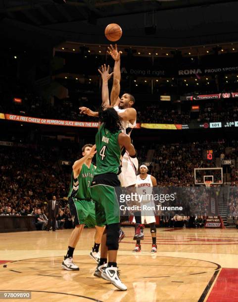 Al Horford of the Atlanta Hawks tries the hookshot in the post over Chris Bosh of the Toronto Raptors during a game on March 17, 2010 at the Air...