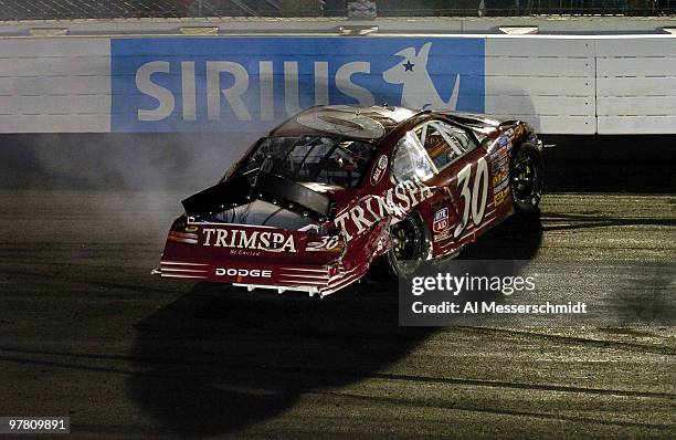 David Stremme hits the second turn wall and heads to the pits with a flat rear tire during the Funai 250 NASCAR Busch Series race at Richmond...