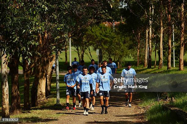 Mark Bridge and Stuart Musalik lead players to training during a Sydney FC A-League training session at Macquarie Field on March 18, 2010 in Sydney,...