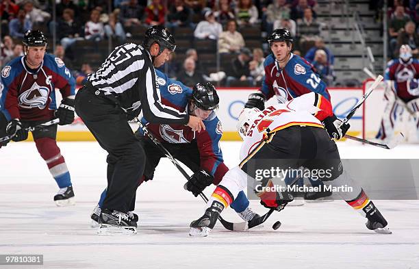 Matt Duchene of the Colorado Avalanche faces off against Matt Stajan of the Calgary Flames at the Pepsi Center on March 17, 2010 in Denver, Colorado....