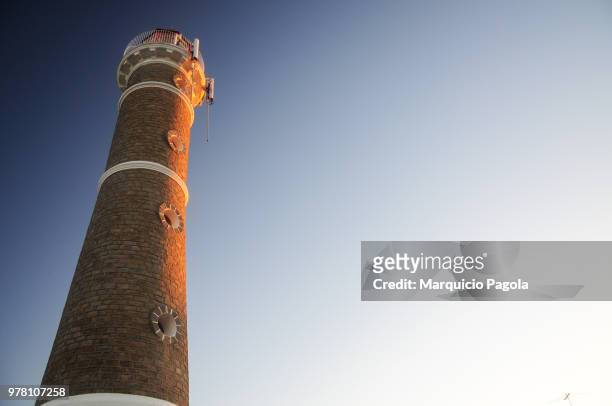 lighthouse under clear sky, jose ignacio, uruguay - jose ignacio lighthouse stock pictures, royalty-free photos & images