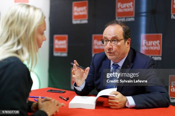 Former French President Francois Hollande signs his book 'Les lecons du pouvoir' at Furet du Nord bookshop on June 18, 2018 in Lille, France.