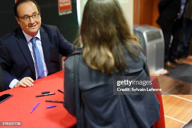 Former French President Francois Hollande signs his book 'Les lecons du pouvoir' at Furet du Nord bookshop on June 18, 2018 in Lille, France.