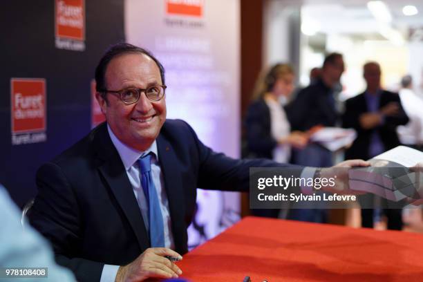 Former French President Francois Hollande signs his book 'Les lecons du pouvoir' at Furet du Nord bookshop on June 18, 2018 in Lille, France.