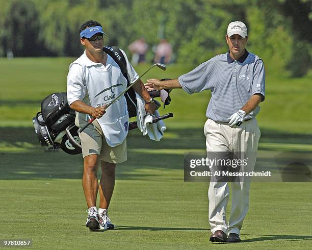 Patrick Sheehan takes a club from his caddy in the second round of the Cialis Western Open July 2, 2004 in Lemont, Illinois.