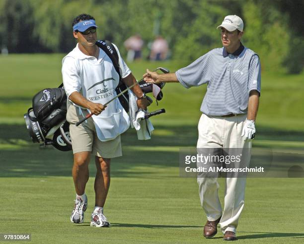 Patrick Sheehan takes a club from his caddy in the second round of the Cialis Western Open July 2, 2004 in Lemont, Illinois.