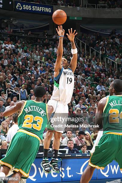 Wayne Ellington of the Minnesota Timberwolves puts up a jump shot against Wesley Mathews and Paul Millsap of the Utah Jazz at EnergySolutions Arena...