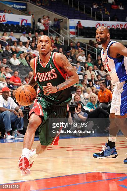 Brandon Jennings of the Milwaukee Bucks drives to the basket past Baron Davis of the Los Angeles Clippers at Staples Center on March 17, 2010 in Los...