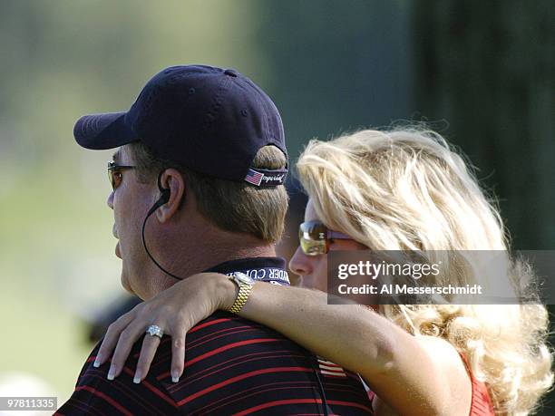 Hal Sutton watches play on the eighth hole with his wife, Ashley, during Sunday afternoon singles matches at the 2004 Ryder Cup in Detroit, Michigan,...