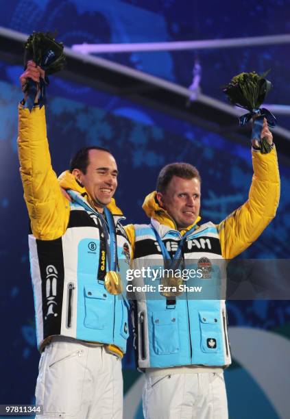 Gold medalist Wilhem Brem of Germany and guide Florian Grimm celebrate during the medal ceremony for the Men's 12.5km Visually Impaired Biathlon on...