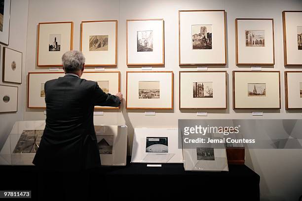 Washington DC based gallery owner Gary Edwards of the Gary Edwards gallery at work in his exhibit space at the gala preview of the AIPAD Photography...