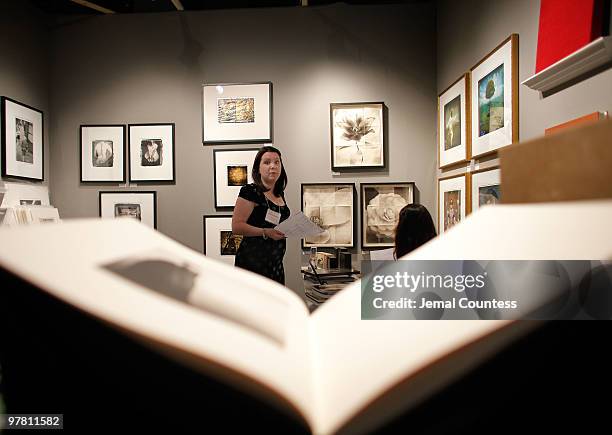 Owner and director of the John Cleary Gallery Catherine Couturier in her exhibition space during the gala preview of the AIPAD Photography Show at...