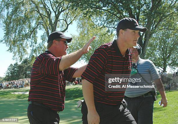 Captain Hal Sutton pasts Chad Campbell on the back during Sunday afternoon singles matches at the 2004 Ryder Cup in Detroit, Michigan, September 19,...