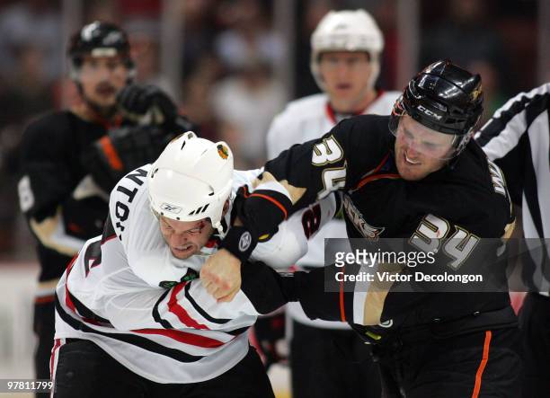 James Wisniewski of the Anaheim Ducks punches Nick Boynton of the Chicago Blackhawks during their fight in the third period of their NHL game at the...