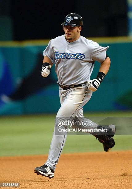 Toronto Blue Jays first baseman Eric Hinske rounds first base aftr a home run in the season opener April 4, 2005 against the Tampa Bay Devil Rays....