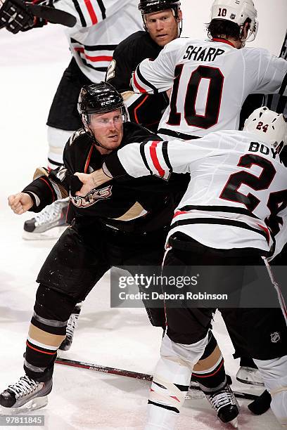 Nick Boynton of the Chicago Blackhawks fights with James Wisniewski of the Anaheim Ducks during the game on March 17, 2010 at Honda Center in...