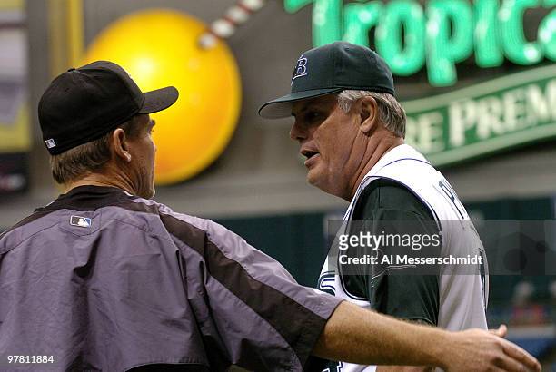 Tampa Bay Devil Rays manager Lou Piniella talks with Toronto Blue Jays manager John Gibbons before the season opener April 4, 2005.
