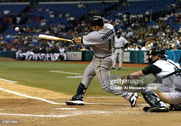 Toronto Blue Jays first baseman Eric Hinske pulls a ball down the line in the season opener April 4, 2005 against the Tampa Bay Devil Rays. The Blue...