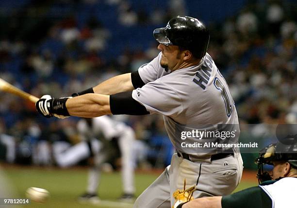 Toronto Blue Jays first baseman Eric Hinske pulls a ball down the line in the season opener April 4, 2005 against the Tampa Bay Devil Rays. The Blue...