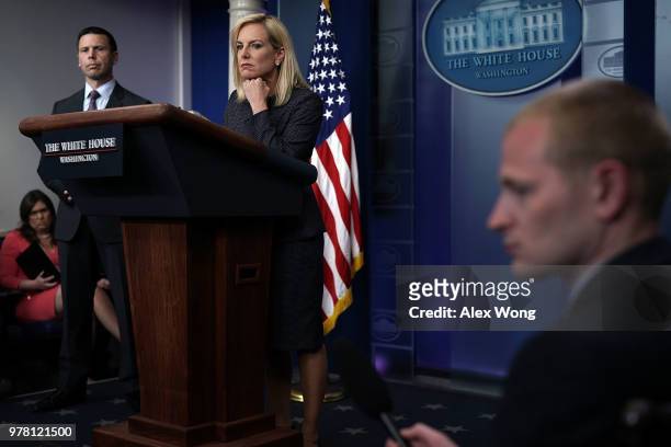 Secretary of Homeland Security Kirstjen Nielsen and Commissioner of U.S. Customs and Border Protection Kevin McAleenan listen during a White House...