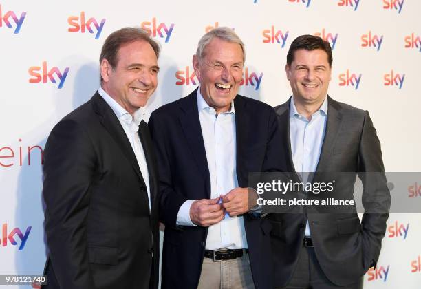 April 2018, Germany, Unterfoehring near Munich: Carsten Schmidt, CEO of Sky Deutschland, Joerg Wontorra, presenter, and Christian Seifert, chief...